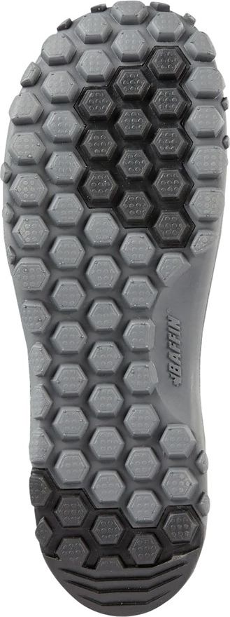 A sole of footwear with a repeating hexagonal tread pattern.