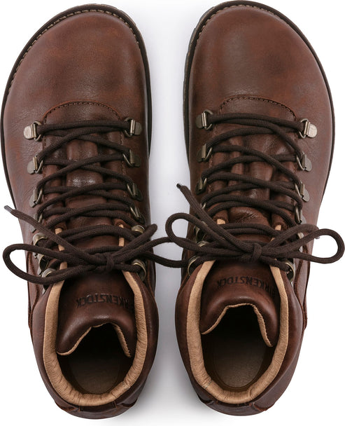 Top-down view of a pair of brown leather hiking boots with metal eyelets and brown laces.