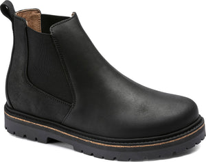 Black leather chelsea boot with lug sole.
