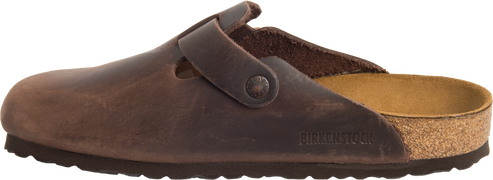 Brown leather clog with adjustable strap and cork sole.