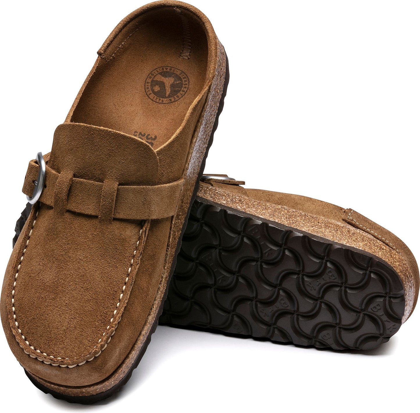 Two brown suede clogs with a moccasin style toe and buckle strap.
