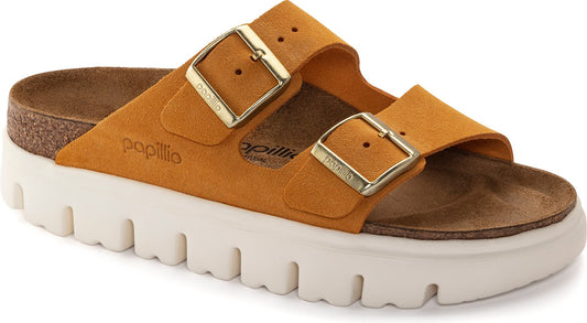 Low heel mustard-colored sandal with gold buckles and a white platform sole.