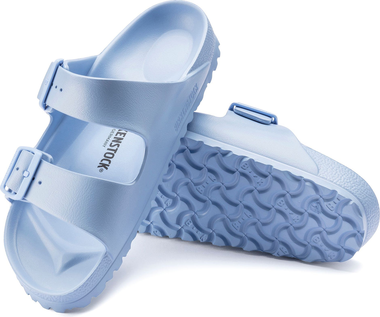 Two light blue molded plastic sandals with adjustable buckles, one showing the textured sole.