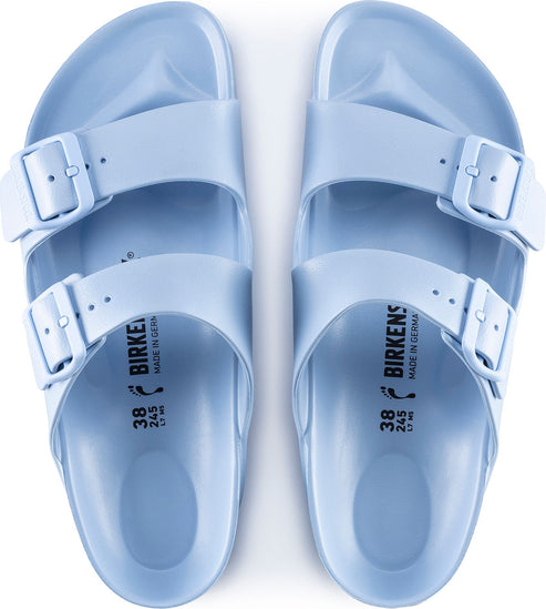 Pair of light blue sandals, top view.