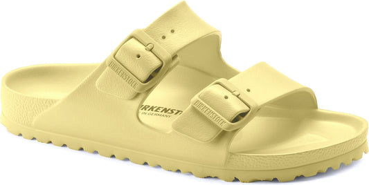 Yellow double-buckle sandals with textured soles.