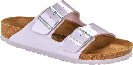 A pair of lavender sandals with silver buckles.