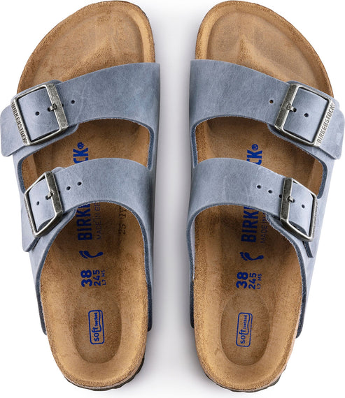 Two light blue sandal pairs with two adjustable straps, metallic buckles and cork soles showing size 38.