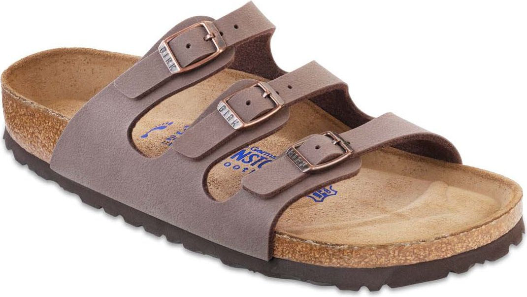 Taupe slide sandal with three buckled straps and a cork footbed.