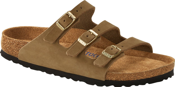 A light brown sandal with three buckled straps.