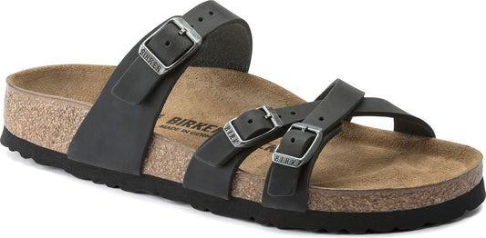 A black sandal with multiple straps and silver buckles.