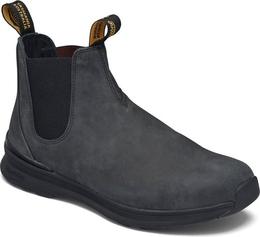 Gray suede Chelsea boot with black elastic side panels, black soles, and yellow pull tabs.