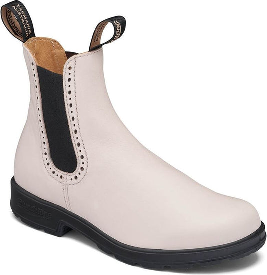 An off-white Chelsea boot with black elastic side panels and a black lug sole.