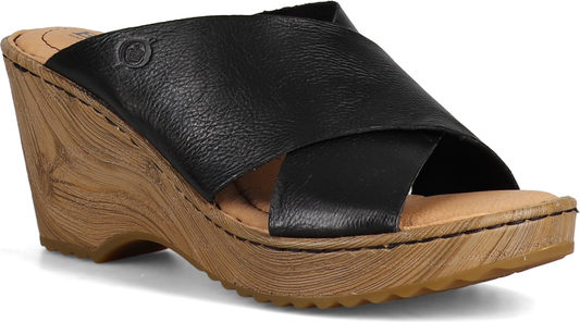 Black sandal with a wedge heel and criss-cross straps.