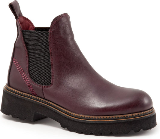 Maroon leather Chelsea boot with black elastic side panels and a thick black lug sole.