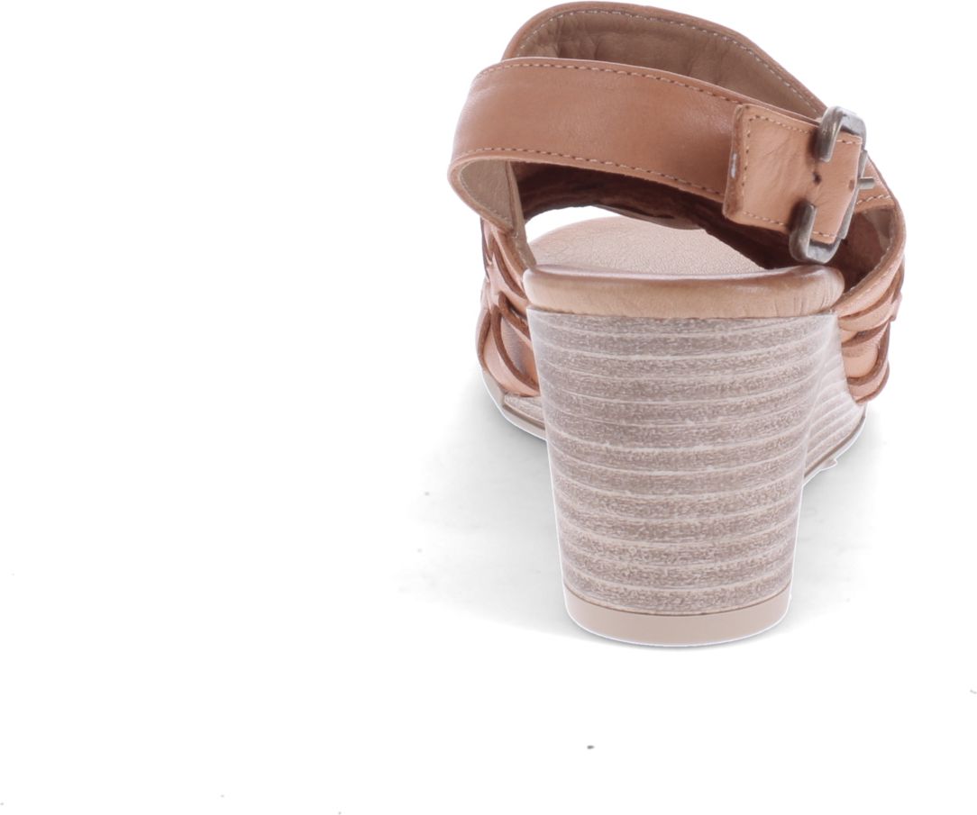 Tan wedge sandal with interwoven straps and an ankle strap.