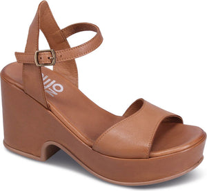 Platform wedge sandal in tan leather with ankle strap and buckle.