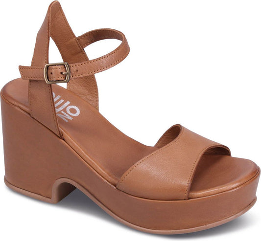 Platform wedge sandal in tan leather with ankle strap and buckle.