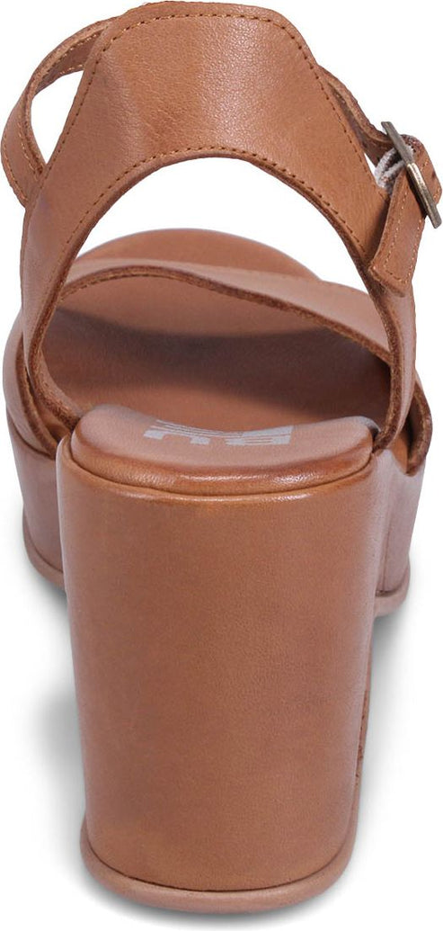 Close-up rear view of a brown sandal with a buckled ankle strap and block heel.