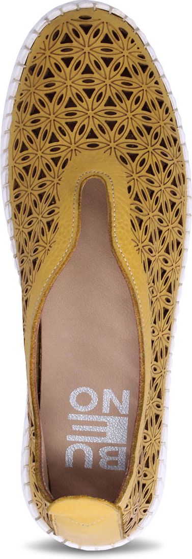 A yellow shoe with floral cutouts.