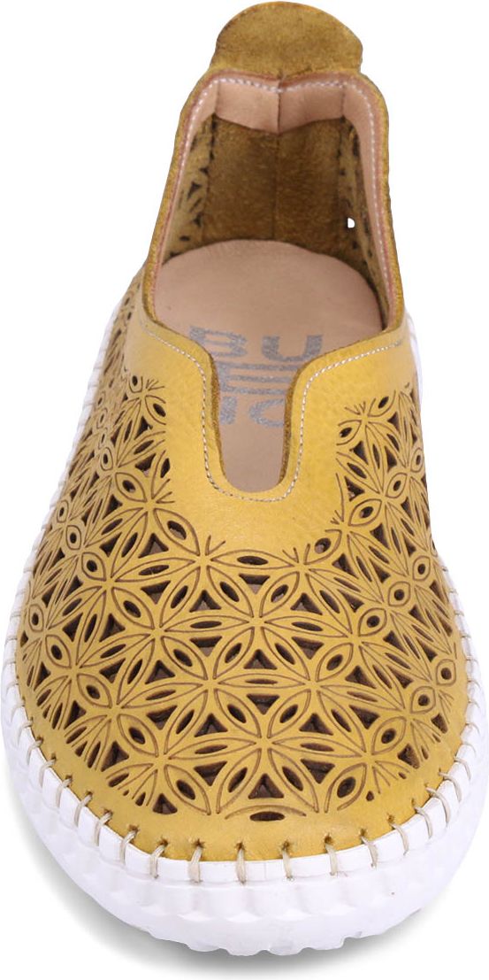 Yellow slip-on shoe with floral cutouts and white sole.