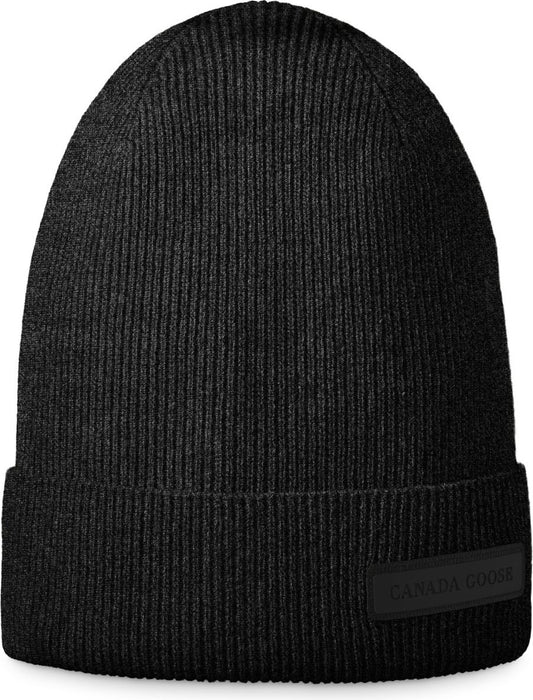 Black knit beanie hat with a folded brim.