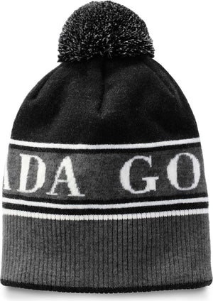 Knitted gray and black hat with pompom and white "ADA GO" text.