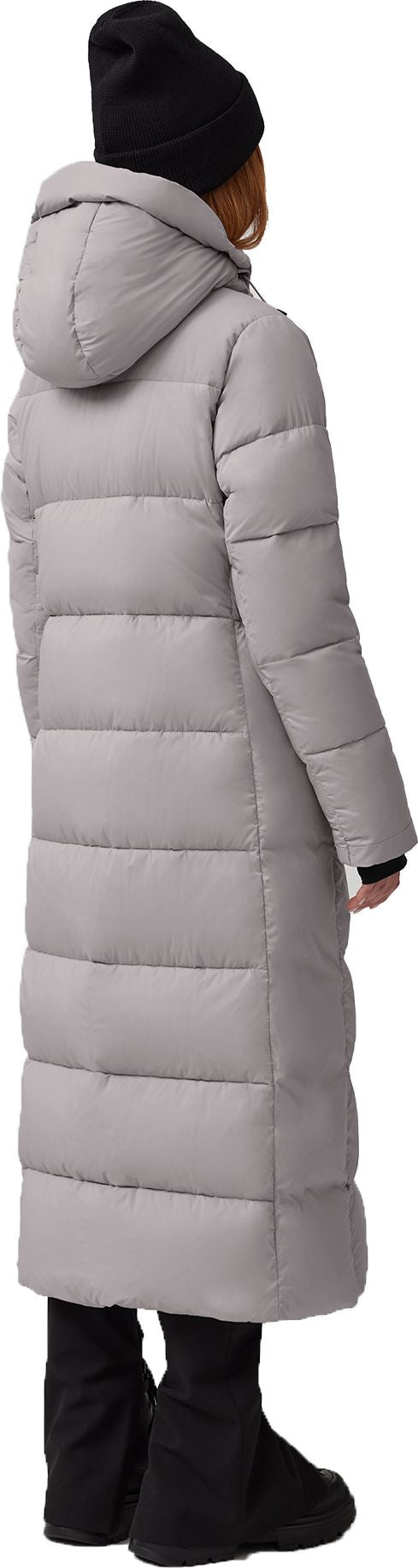 A person wearing a long gray puffer coat and a black beanie.