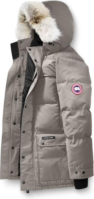 A grey, fur-trimmed parka with a circular logo on the left sleeve.