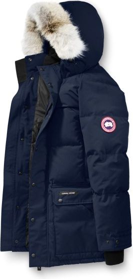 A navy blue, hooded parka trimmed with white fur around the hood.