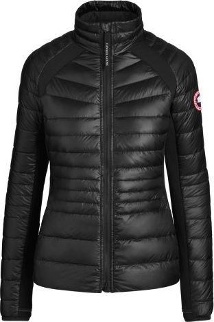 Black quilted jacket with logo patch on the sleeve.