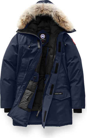 Open navy blue parka with fur-trimmed hood, and black trim.