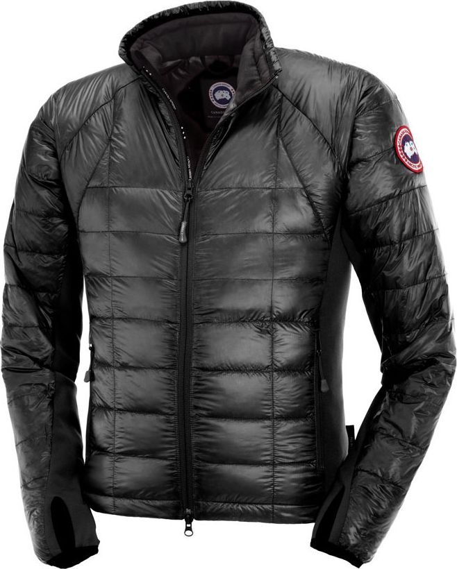 A puffy, black jacket with a round logo on the left shoulder, a full zipper in the front, and thumb holes on the sleeves.