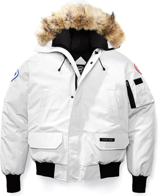 White bomber jacket with a fur-lined hood and a logo on the left pocket.