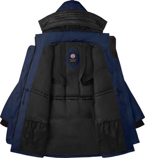 Open blue parka with black interior showing hood, collar, drawstrings, pockets, and logo patch.