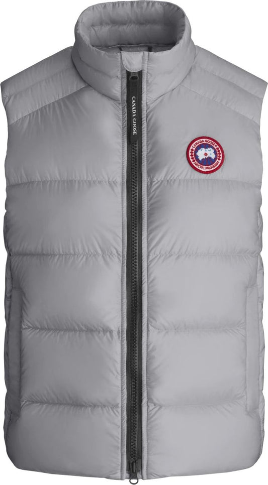 Grey quilted vest with a full front zipper and a round logo patch on the chest.