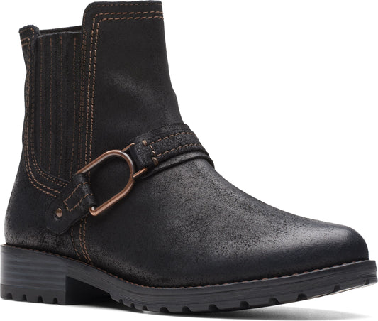 Black leather ankle boot with elastic goring, brown stitching, a metal buckle strap, and a stacked heel.
