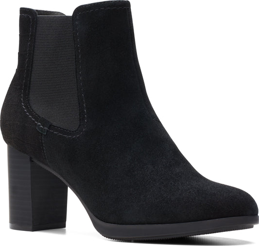 A black suede heeled boot with elastic side panels.