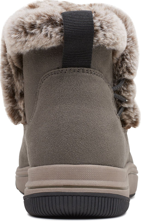 The back view of an ankle boot with a faux fur collar, a pull tab, and a stacked sole.