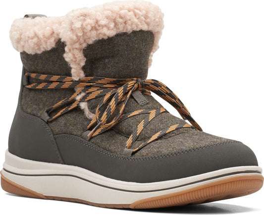 Olive green boot with a white sole and tan lining and brown and orange shoe laces.
