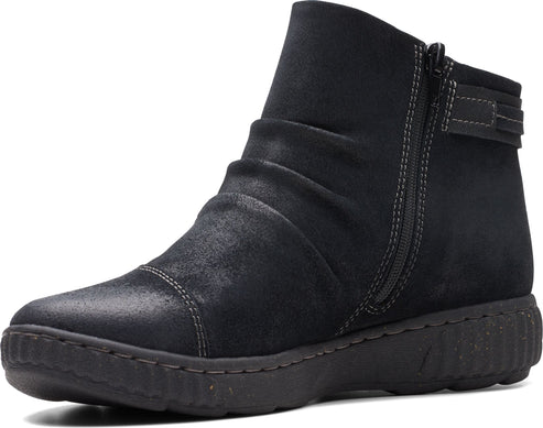A low, black, casual boot with a zipper, strap, and rounded toe.