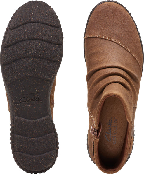 Top-down view of a brown ankle boot, showing the sole and upper, with a side zipper and gathered leather.