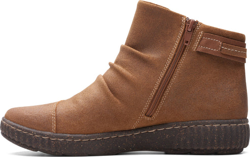 Ankle boot in brown nubuck with a side zipper and a strap around the ankle.