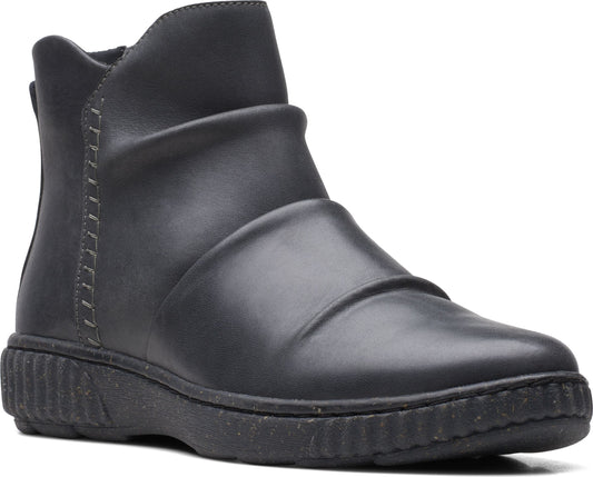 Black leather ankle boot with a low, ridged sole and gathered detailing across the vamp.