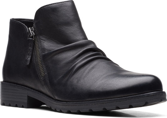 A women's black leather ankle boot with a side zipper and a low heel.