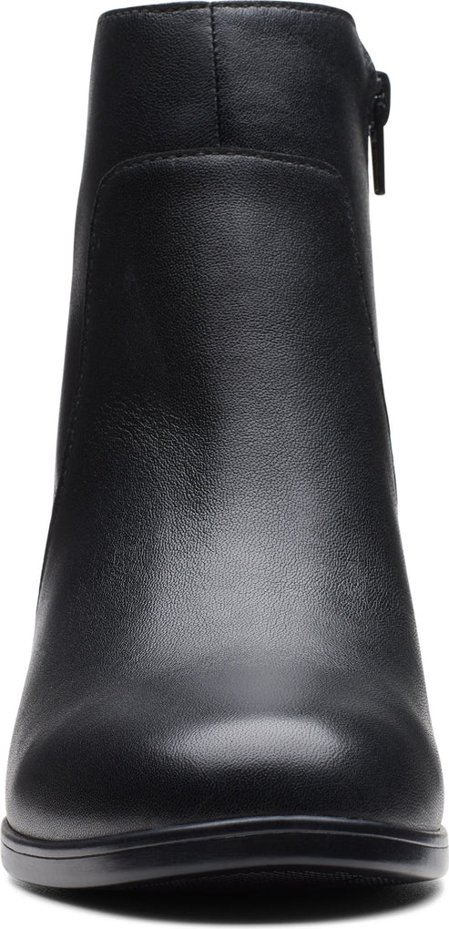 A black ankle boot with a zipper.