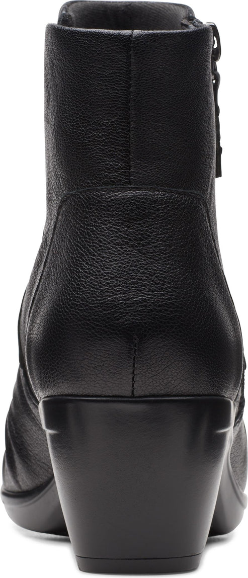 Back view of a black leather ankle boot with a block heel and side zipper.