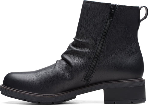 Black leather ankle boot with side zipper and block heel.