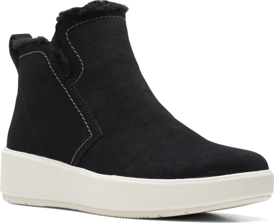 Black suede bootie with faux fur trim and thick white sole.