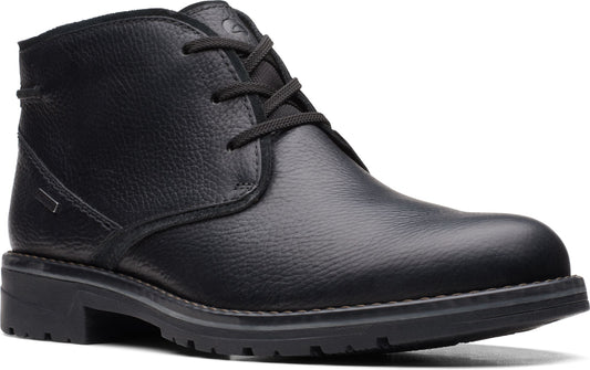 Black leather chukka boot with laces and a rugged sole.
