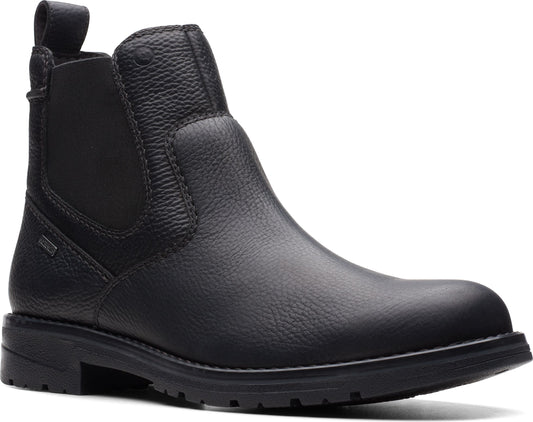 Black leather Chelsea boot with pull tab and elastic ankle panels.